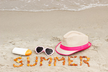 Inscription summer and accessories for vacation on sand at beach, sun protection, summer time