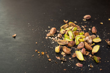 pistachios on black slate table