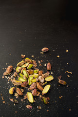 pistachios on black slate table