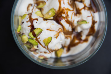 ice cream with pistachios in a mug, top view