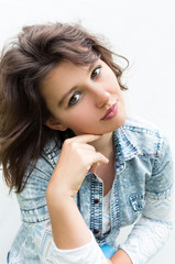 Young woman on a white studio background