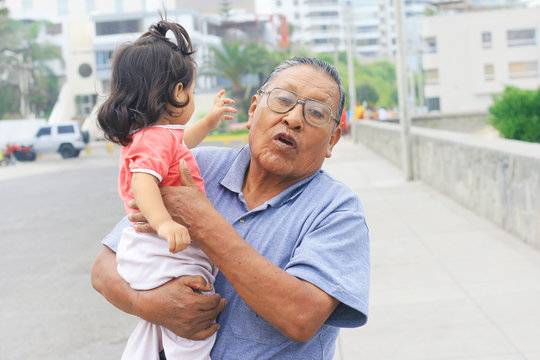 Latin grandfather with granddaughter