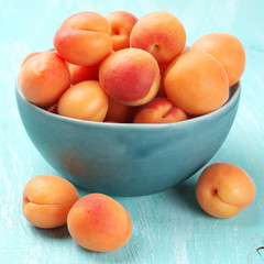 Apricots in blue bowl
