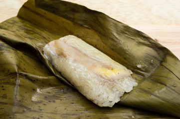 Khao Tom Mad or Khao Tom Pad,Bananas in Sticky Rice,Thai cuisine on wood background