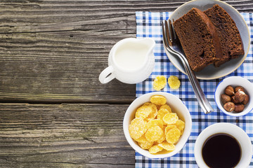 Homemade breakfast option.  chocolate cake, cereals, nuts, hazelnuts, milk