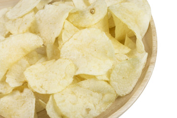 potato chips in wood plate on white background.