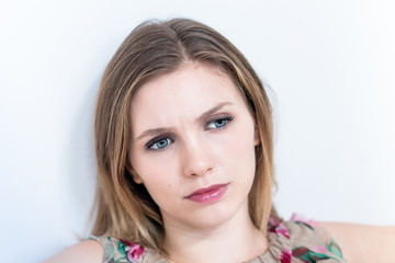 Naklejka premium Depressed, sad woman on white background