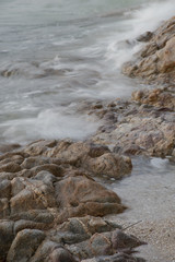 stones by the sea. waves of the sea from long exposure.