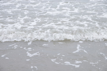 Soft wave of the sea on the beach.