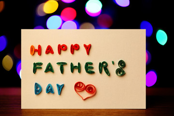 Homemade Happy Father’s Day Card on the Background of Light Bokeh
