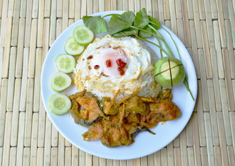 spicy catfish curry and fried egg on rice