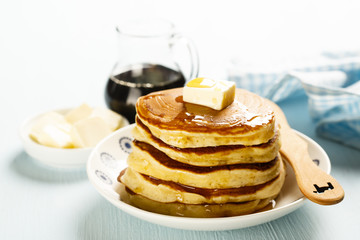 Pancakes with butter and maple syrup