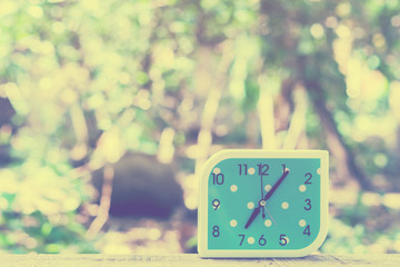 blue alarm clock on bokeh background,Close up blue alarm clock,vintage tone

