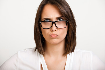 Obraz premium Portrait of girl playing ape over white background.