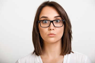 Obraz premium Portrait of girl playing ape over white background.