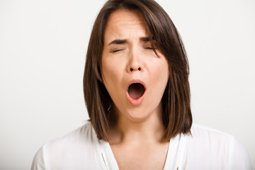 Portrait of girl playing ape over white background.