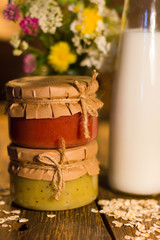 Banana and grapefruit jam in jars and milk in the bottle