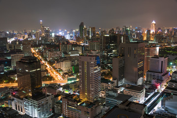 Naklejka premium Aerial view of Bangkok city at night. Modern megalopolis cityscape at night