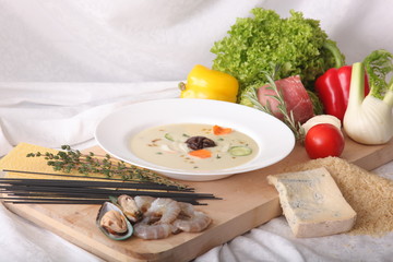 Italian vegetable soup, surrounded by fresh food