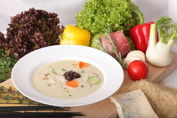Italian vegetable soup, surrounded by fresh food