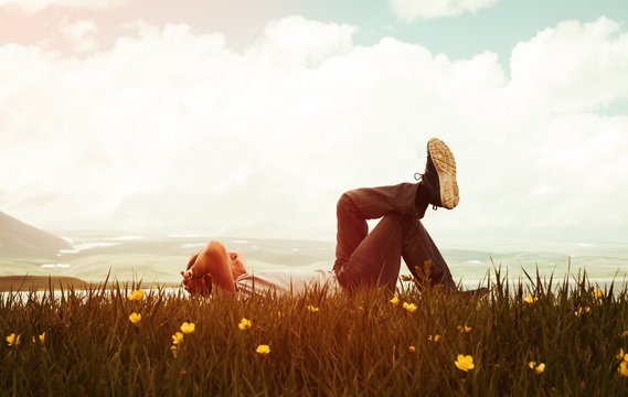 Man on the grass in sunset