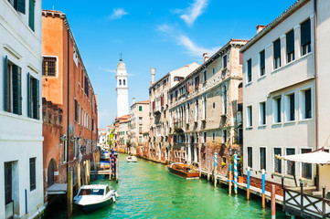 Scenic canal with ancient buildings in Venice, Italy