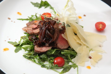 roastbeef with rucola on plate
