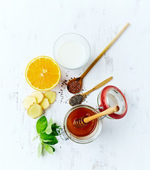 Obraz na płótnie Canvas Organic Ingredients for Orange and Ginger Smoothie with Almond Milk (detox smoothie)