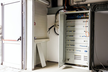 Electrical cabinet has panel with automatic fuse switches