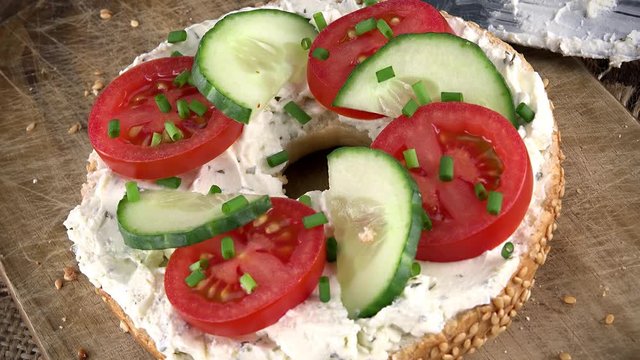 Bagels with Cream Cheese and vegetables (rotating, close-up) as not loopable 4K UHD footage