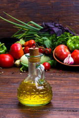 olive oil on vegetables background