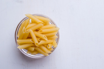 penne in glass bowl
