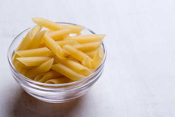 penne in glass bowl