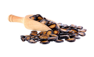 watermelon seeds in a scoop on white background