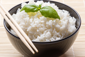 cooked rice in black bowl