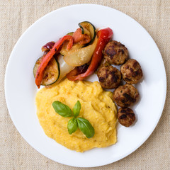 polenta with meatballs and vegetables