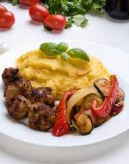 polenta with meatballs and vegetables
