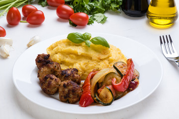 polenta with meatballs and vegetables