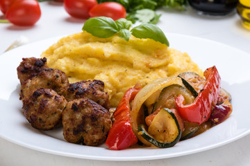 polenta with meatballs and vegetables