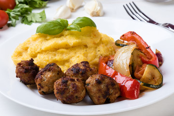 polenta with meatballs and vegetables