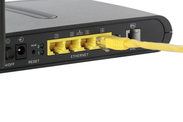yellow network cable connected on a network port