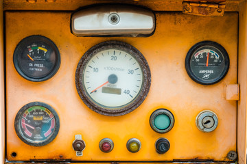 Old yellow machinery control panel.