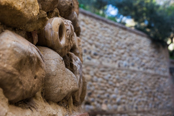 Obraz premium Small drain pipe protruding from a ancient wall. Made in ceramics. Antequera. Andalucia. Spain.