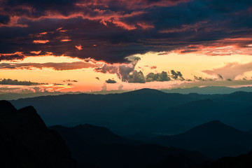 Sunset in mountains over hills