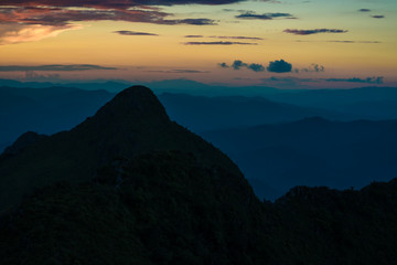 Sunset in mountains over hills
