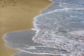 Soft wave of the sea on the sandy beach