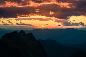 Sunset in mountains over hills