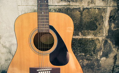 Fototapeta premium detail of classic guitar with grunge background