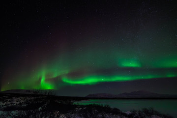 Fototapeta na wymiar An aurora, sometimes referred to as a polar light, is a natural light display in the sky, predominantly seen in the high latitude (Arctic and Antarctic) regions.
