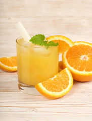 fresh orange juice on a wooden background